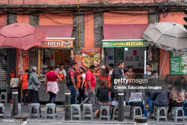 Lively street scene with taco vendors and crowds, centro historico, Mexico City, Mexico.