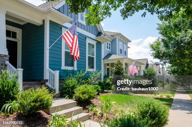 suburban patriotic homes and neighborhoods and the celebration of independence day - front porch no people stock pictures, royalty-free photos & images