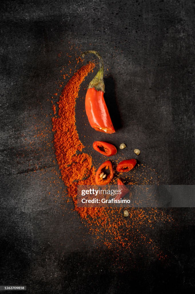 Chili Pepper red powder on black background
