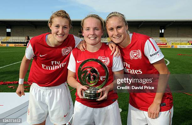 Ellen White, Kim Little and Steph Houghton of Arsenal pose with the League Cup trophy following the FA WSL Continental Cup Final between Birmingham...