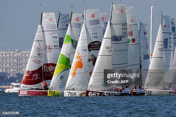 Competitors take the start of the Transat sailing race, from La Rochelle to Salvador Do Bahia in Brazil, on their monuhull on September 25, 2011. AFP...