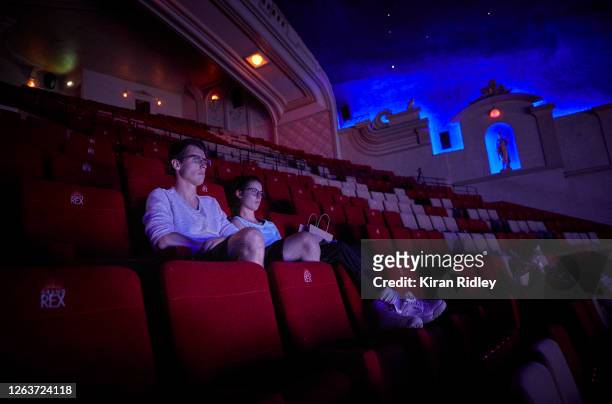 Audience members watch the last screenings in the Grand Salle, the largest auditorium in Europe, at the Grand Rex cinema before it closes its doors...