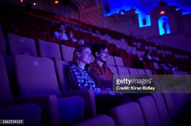 Audience members the last screening in the Grand Salle, the largest auditorium in Europe, at the Grand Rex cinema before it closes its doors until...