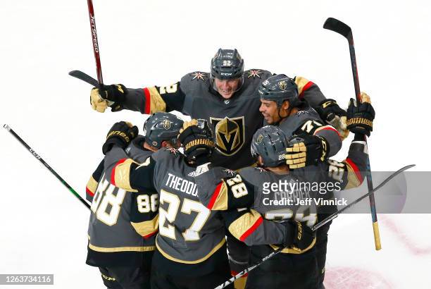 William Carrier of the Vegas Golden Knights is congratulated by teammates Shea Theodore,Nate Schmidt,Tomas Nosek and Ryan Reaves of the Vegas Golden...