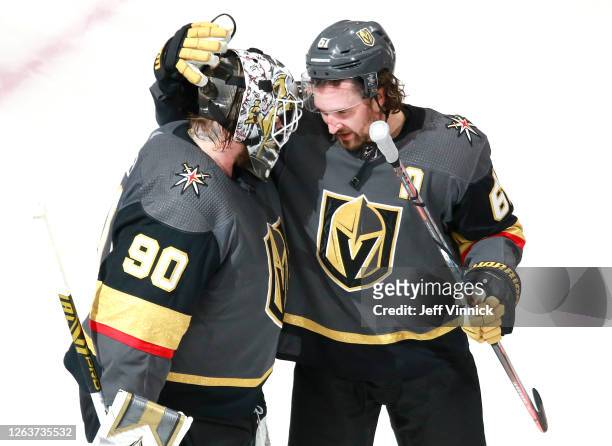 Robin Lehner of the Vegas Golden Knights is congratulated by teammate Mark Stone after they defeated the Dallas Stars 5-2 in a Western Conference...