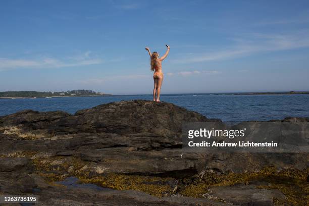 Teenager looks on the coast on July 20, 2020 in Cape Elizabeth, Maine.