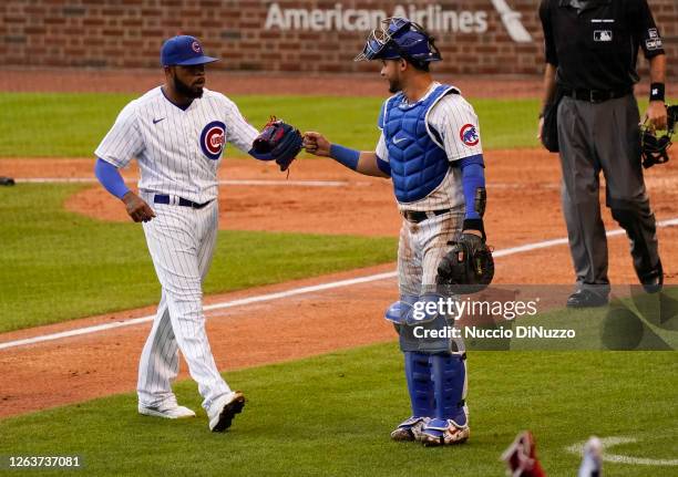 Jeremy Jeffress of the Chicago Cubs and Willson Contreras during the game against the Pittsburgh Pirates at Wrigley Field on August 02, 2020 in...