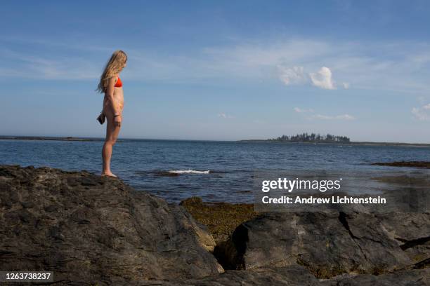 Teenager looks on the coast on July 20, 2020 in Cape Elizabeth, Maine.