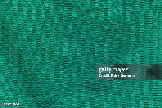 close up green fabric texture. textile background. - textilien stock-fotos und bilder