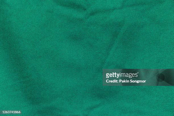 close up green fabric texture. textile background. - materiale tessile foto e immagini stock