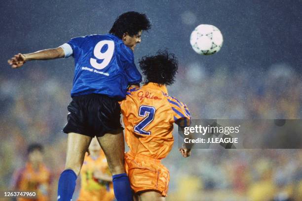 Akihiro Nagashima of Gamba Osaka and Hiroshi Saito of Shimizu S-Pulse compete for the ball during the J.League Suntory Series match between Shimizu...