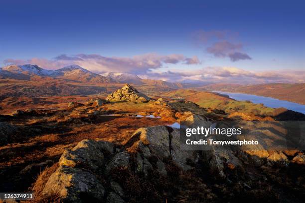 coniston water in winter, with cairn. - coniston stock pictures, royalty-free photos & images