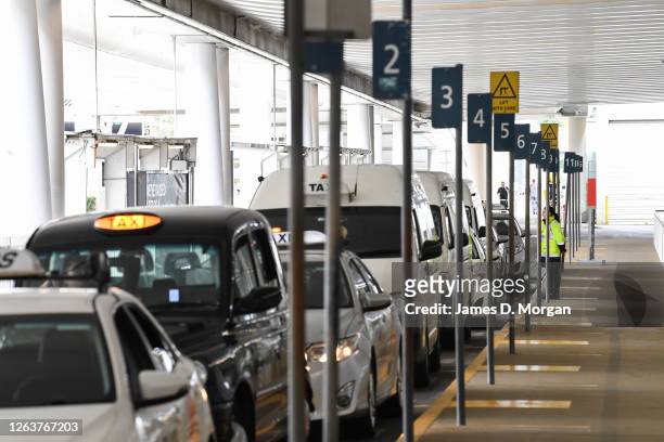 Taxis await passengers requiring a ride to their final destination at the Jetstar Domestic Terminal at Sydney Airport on August 04, 2020 in Sydney,...