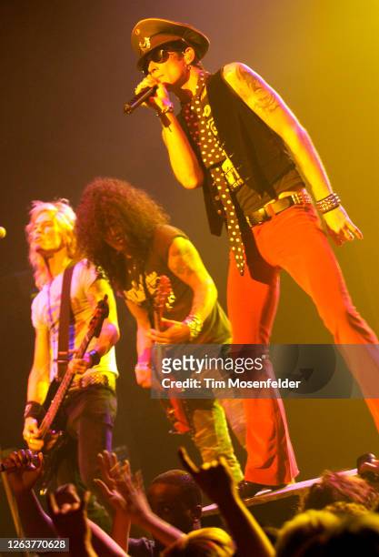 Duff McKagan, Slash, and Scott Weiland of Velvet Revolver perform at the Warfield theatre on June 7, 2004 in San Francisco, California.