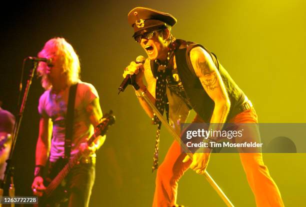 Duff McKagan and Scott Weiland of Velvet Revolver perform at the Warfield theatre on June 7, 2004 in San Francisco, California.