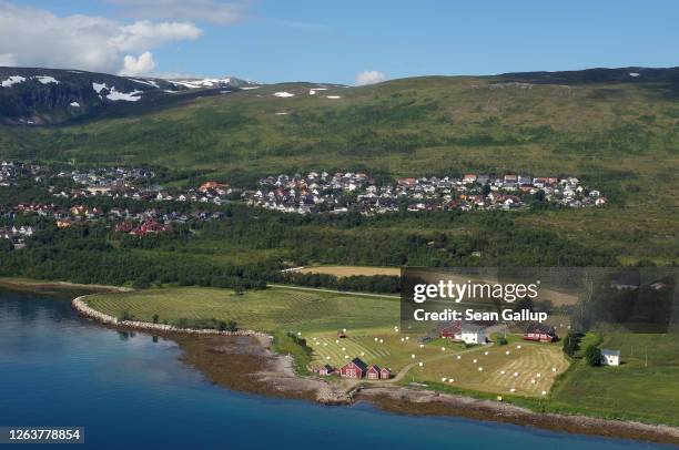 Farm lies on the city outskirts as seen from a passenger plane window on July 28, 2020 near Tromso, Norway. Tromso is the third largest city in the...