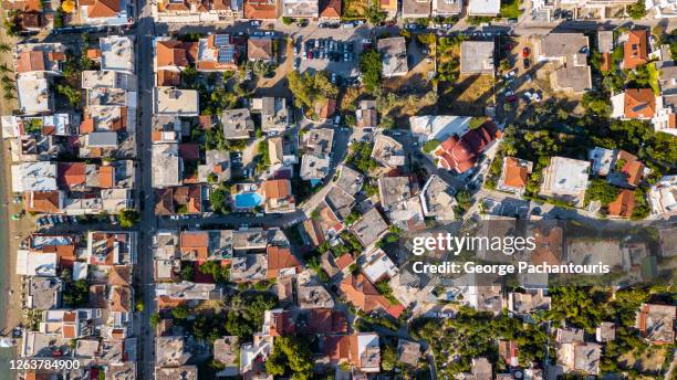 top down aerial view of small greek town - otlo stock pictures, royalty-free photos & images