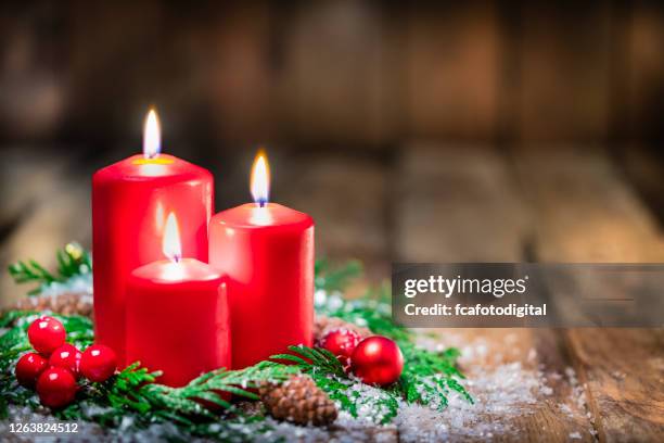 christmas candles on rustic wooden table. copy space - christmas memories stock pictures, royalty-free photos & images