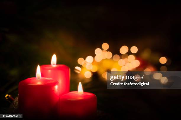 christmas candles on rustic wooden table. copy space - advent stock pictures, royalty-free photos & images