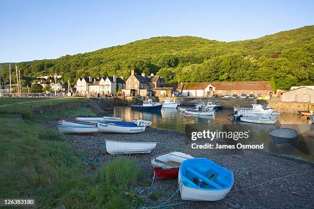 small fishing boats in the harbour at porlock weir near exmoor national park. - exmoor national park stock pictures, royalty-free photos & images