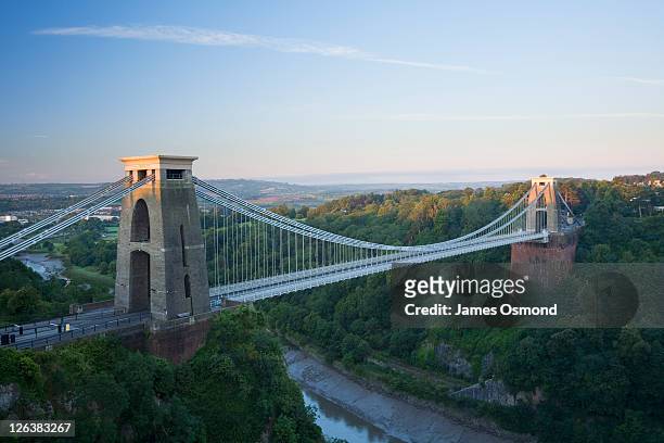 sunrise over the clifton suspension bridge spanning the avon gorge in bristol. - clifton bridge stock pictures, royalty-free photos & images