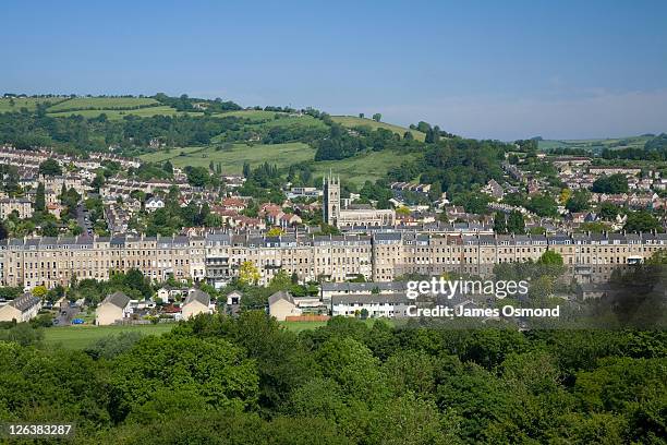 view across the historic city of bath with rows of georgian houses and the grand abbey - bath england ストックフォトと画像