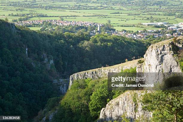 looking over the cheddar gorge with cheddar village in the distance. - cheddar village stock pictures, royalty-free photos & images