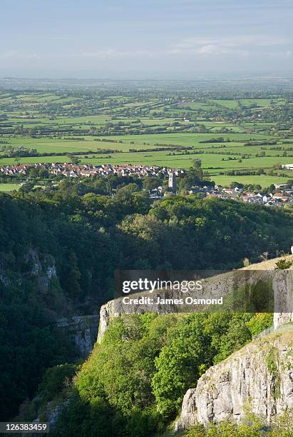 looking over the cheddar gorge with cheddar village in the distance. - cheddar village stock pictures, royalty-free photos & images
