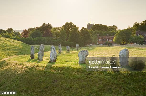 neolithic standing stones at avebury. wiltshire. england. uk. - stone circle stock pictures, royalty-free photos & images