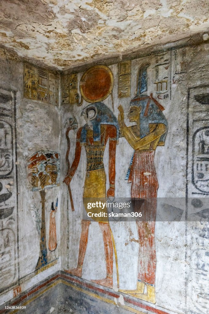 Ruin stone carving god horus and osiris , anubis