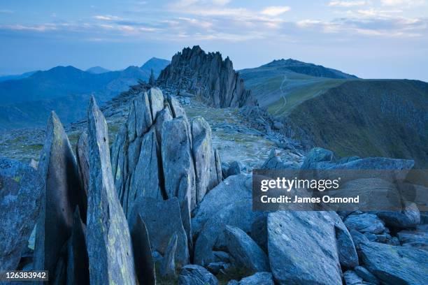 glyder fach looking towards castell y gwynt and glyder fawr with mt snowdon in the distance. snowdonia national park. conwy. wales. uk. - crag stock pictures, royalty-free photos & images