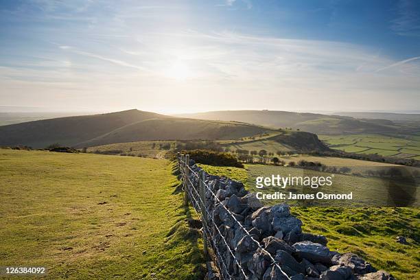 view of crook peak from wavering down in the mendip hills in spring. somerset, england. uk. - somerset stock pictures, royalty-free photos & images
