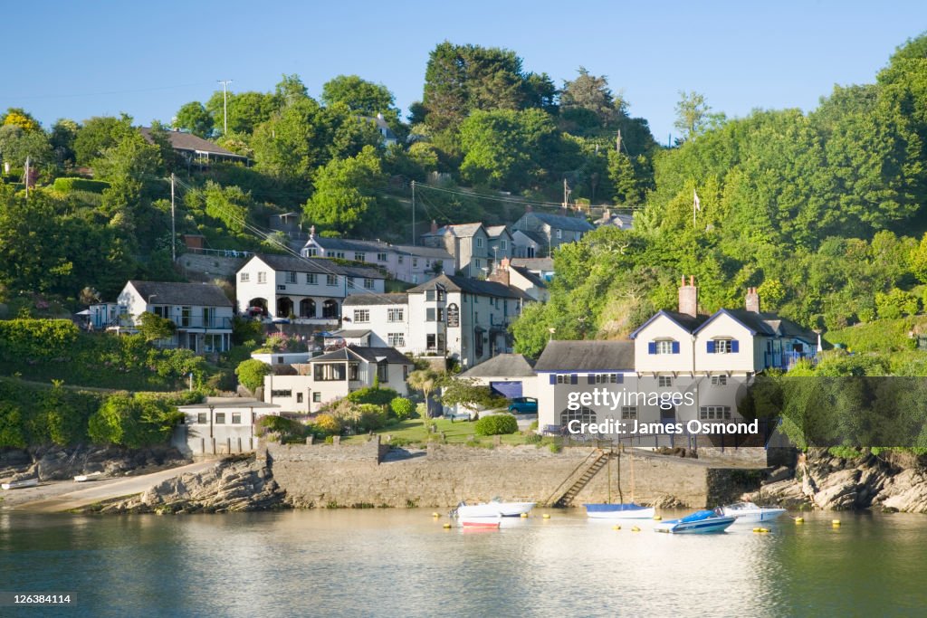 Bodinnick seen across the River Fowey from Fowey, with 'Ferryside', former home of Daphne Du Maurier, on the right. Cornwall. England.