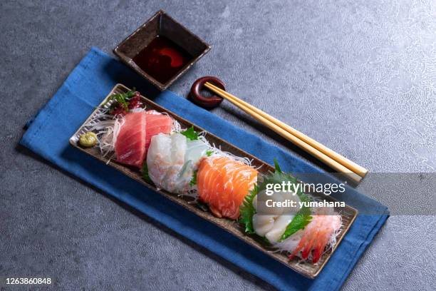 japanese food mixed sashimi on gray stone - shiso stock pictures, royalty-free photos & images