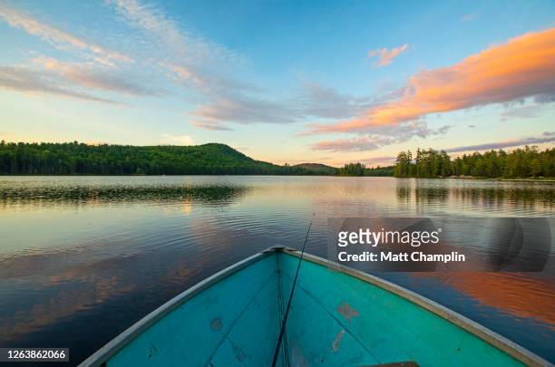 rowboat in lake at sunset - adirondack mountains stock pictures, royalty-free photos & images