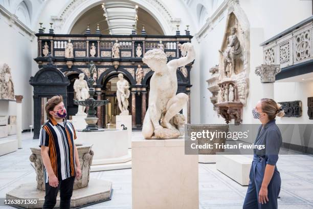 Members of staff walk through the galleries ahead of the reopening of the V&A at The V&A on August 04, 2020 in London, England. The V&A reopens after...