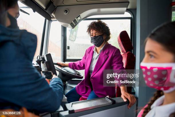 bus driver wearing a protective mask - bus driver mask stock pictures, royalty-free photos & images