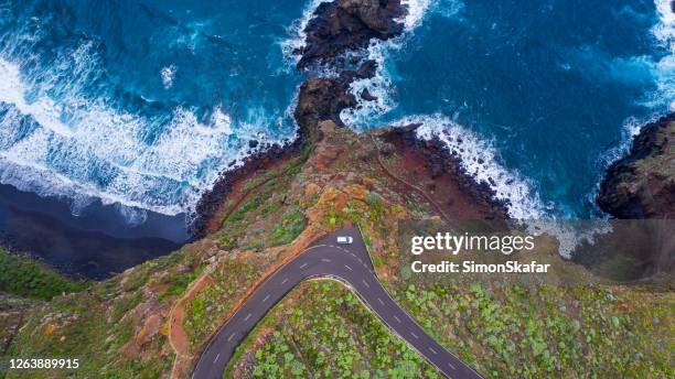 view of road winding along rocky coastline, la palma, canary islands, spain - la palma stock pictures, royalty-free photos & images