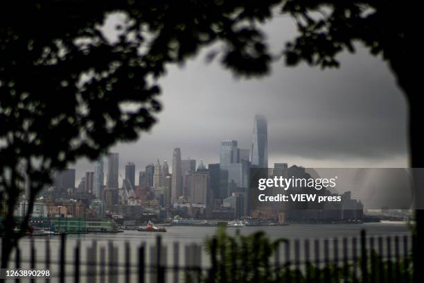 The One World Trade Center and lower Manhattan are pictured as the city gets ready for tropical storm Isaias on August 4, 2020 in New York City. The...