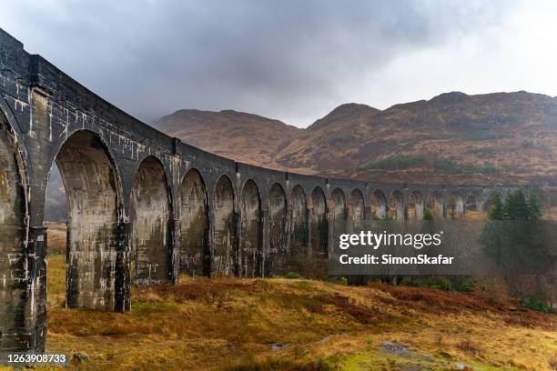 ancient roman aqueduct glenfinnan, scotland - glenfinnan viaduct scotland stock pictures, royalty-free photos & images