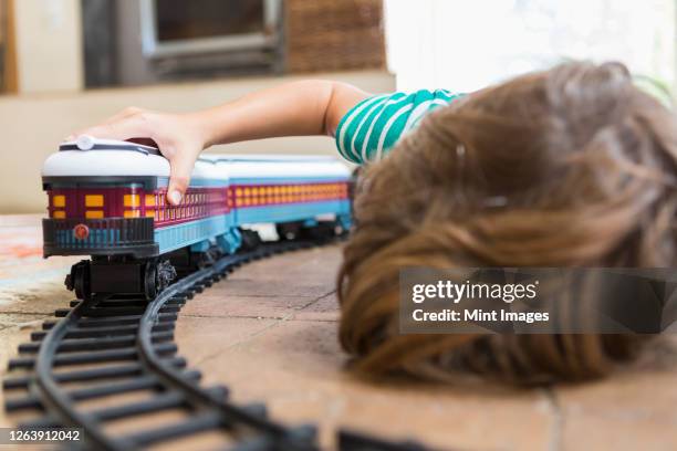 4 year old boy playing with toy train - miniature train stock pictures, royalty-free photos & images