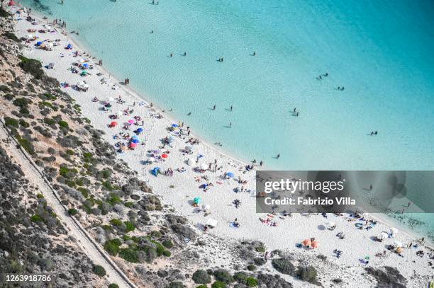 Aerial view of the rabbit island beach in Lampedusa full of tourists on holiday on August 04, 2020 in Lampedusa, Italy. The Italian island has...