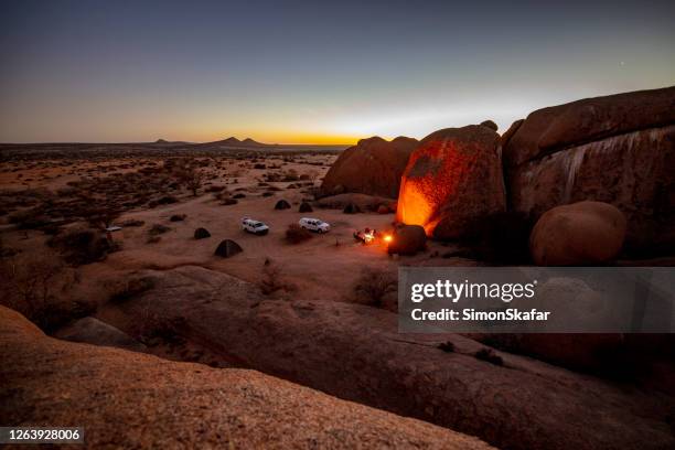 campfire in barren landscape, spitzkoppe, namibia, africa - spitzkoppe stock pictures, royalty-free photos & images