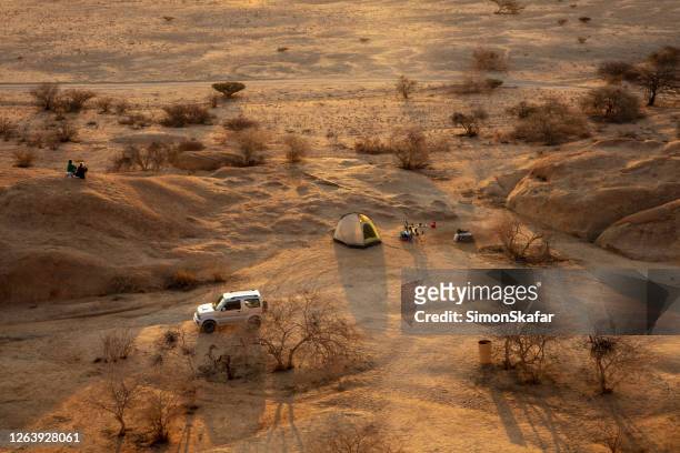 tent and car in desert, spitzkoppe, namibia, africa - desert camping stock pictures, royalty-free photos & images