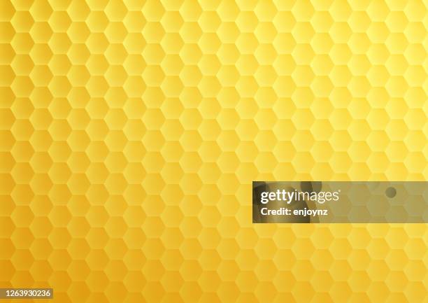 yellow honeycomb hexagon texture - hexagon stock illustrations