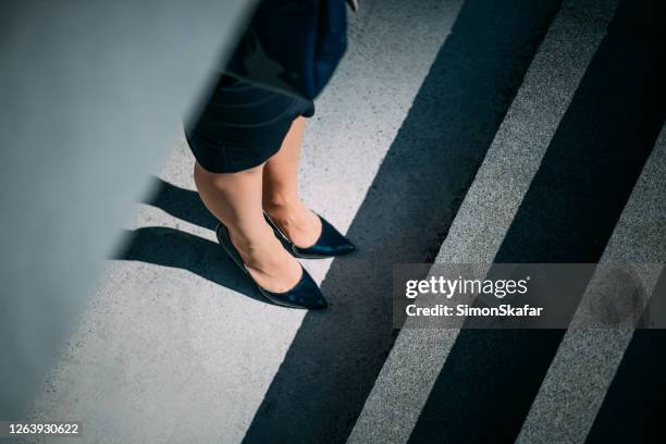 close-up of woman's legs - looking down at shoes stock pictures, royalty-free photos & images