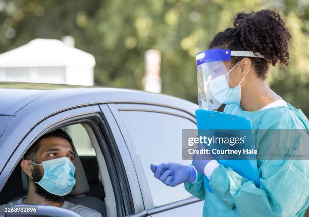 drive through testing site for covid-19 patients - drive through stock pictures, royalty-free photos & images