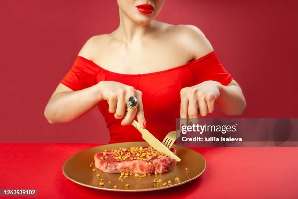 crop woman cutting raw meat - white plate stock pictures, royalty-free photos & images