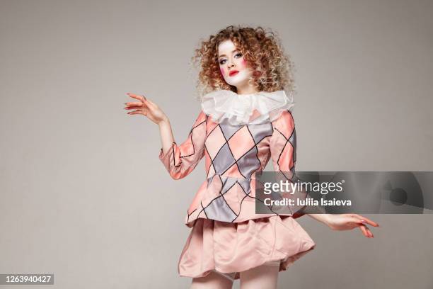 female harlequin looking at camera - theatre costume stock pictures, royalty-free photos & images