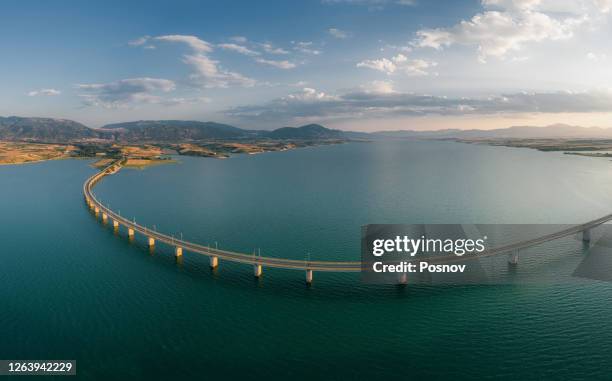 the bridge of lake polyphytos - servia stock pictures, royalty-free photos & images